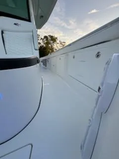 Slide: The Image of 2024 Crevalle 33 CSF boat deck with sleek design at sunset. - 16