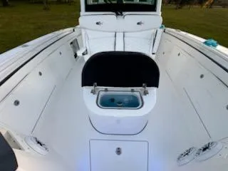 Slide: The Image of 2024 Crevalle 33 CSF boat interior with open storage compartment. - 17