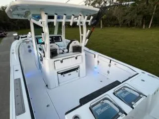 Slide: The Image of 2024 Crevalle 33 CSF boat interior with modern console and seating. - 2