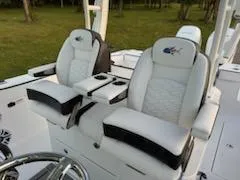Slide: The Image of 2024 Crevalle 33 CSF boat with luxurious white seating and armrests. - 21
