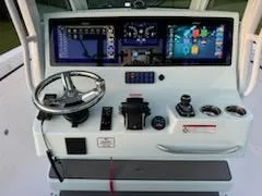 Slide: The Image of 2024 Crevalle 33 CSF boat dashboard with advanced navigation and control systems. - 22