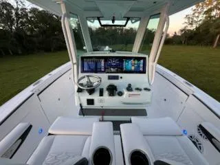 Slide: The Image of 2024 Crevalle 33 CSF boat cockpit with advanced navigation system and sleek design. - 23