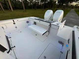 Slide: The Image of 2024 Crevalle 33 CSF boat deck with dual engines and seating. - 27