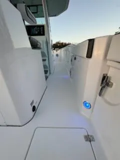 Slide: The Image of 2024 Crevalle 33 CSF boat interior with sleek white design and modern controls. - 29