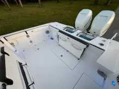 Slide: The Image of 2024 Crevalle 33 CSF boat deck with dual engines and storage compartments. - 31