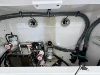 Slide: The Image of 2024 Crevalle 33 CSF boat plumbing system with hoses and valves. - 32
