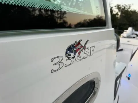 Slide: The Image of 2024 Crevalle 33 CSF boat logo with fish emblem on white surface. - 34