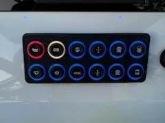 Slide: The Image of Control panel on 2024 Crevalle 33 CSF boat with illuminated buttons. - 37