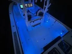 Slide: The Image of 2024 Crevalle 33 CSF boat with blue LED deck lighting at night. - 42