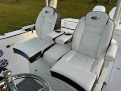 Slide: The Image of 2024 Crevalle 33 CSF boat with luxurious white seating and modern design. - 5