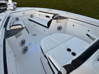 Slide: The Image of 2024 Crevalle 33 CSF boat interior with seating and speakers. - 7