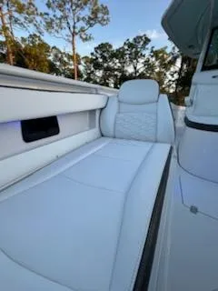 Slide: The Image of 2024 Crevalle 33 CSF boat interior with white seating and sleek design. - 8