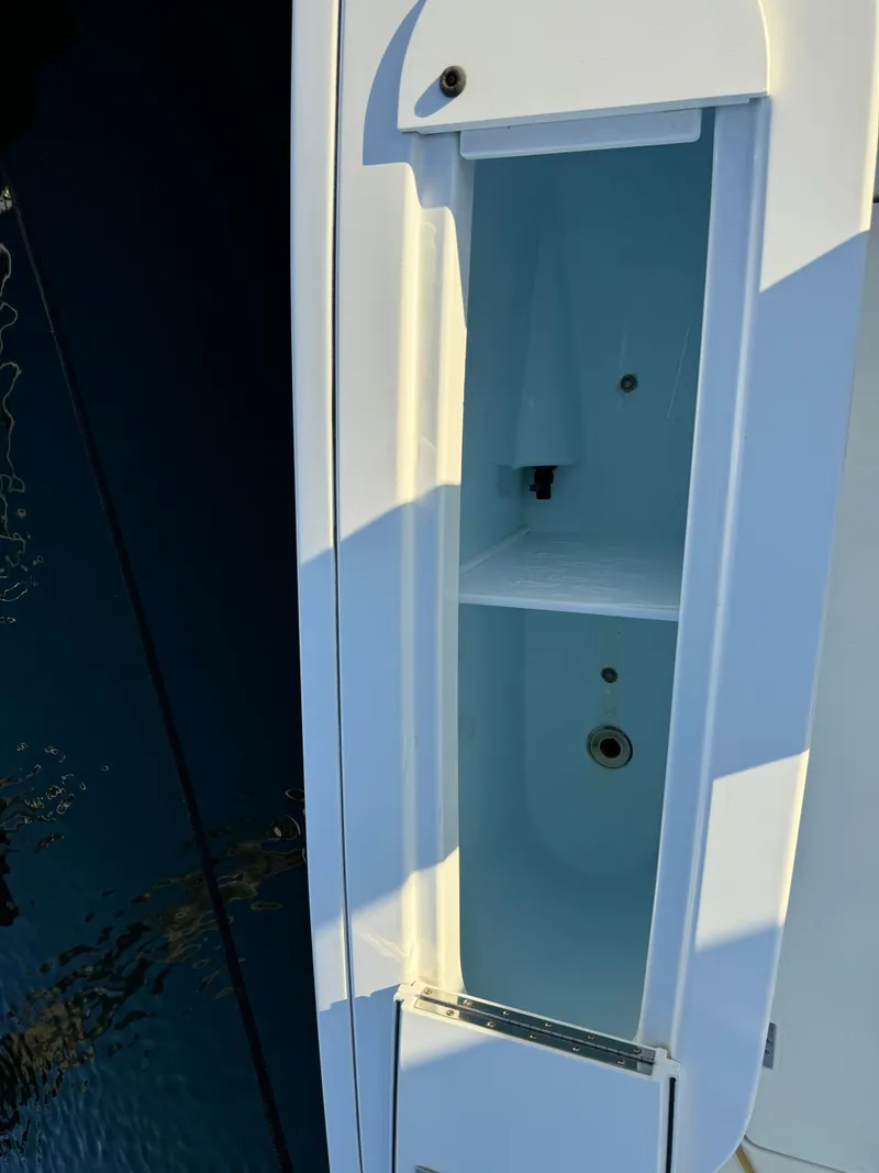 Slide: The Image of Open storage compartment on 2011 Rampage 34 IPS boat. - 42