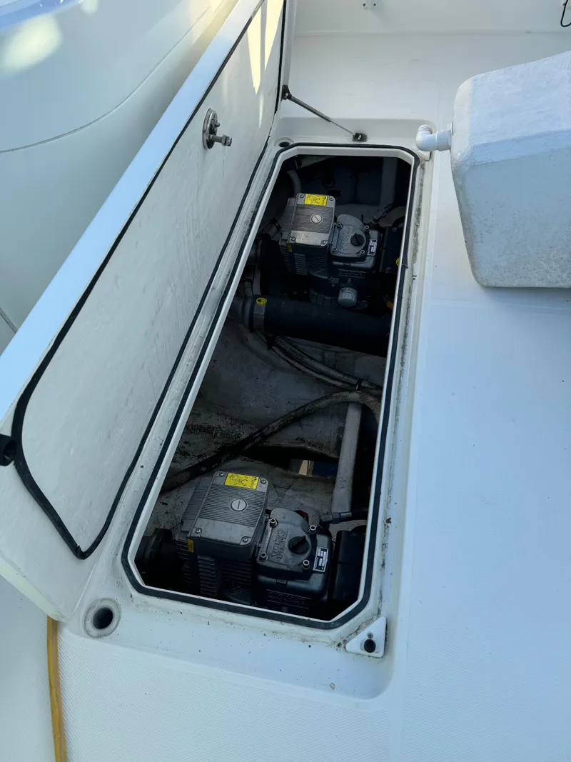 Slide: The Image of Open engine compartment of 2011 Rampage 34 IPS boat, showing dual engines. - 44