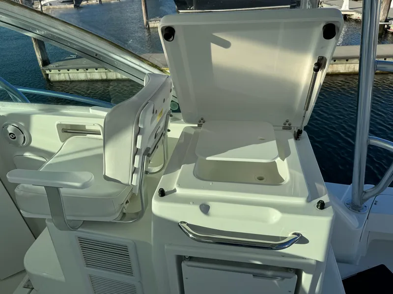 Slide: The Image of 2011 Rampage 34 IPS boat interior with open storage compartment and seating. - 45