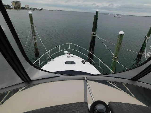 Slide: The Image of 2007 Sea Ray 36 Sedan Bridge yacht docked at marina, view from helm. - 19