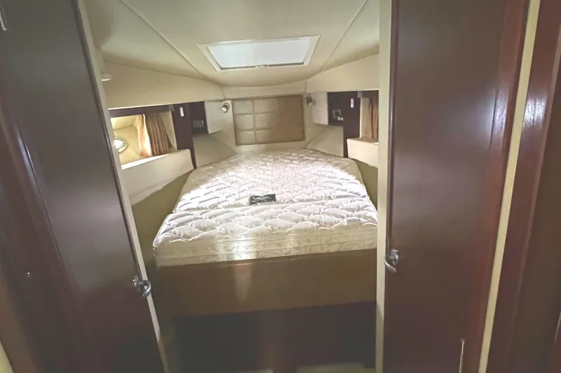 Slide: The Image of Interior cabin of 2007 Sea Ray 36 Sedan Bridge with cozy bed and natural lighting. - 23