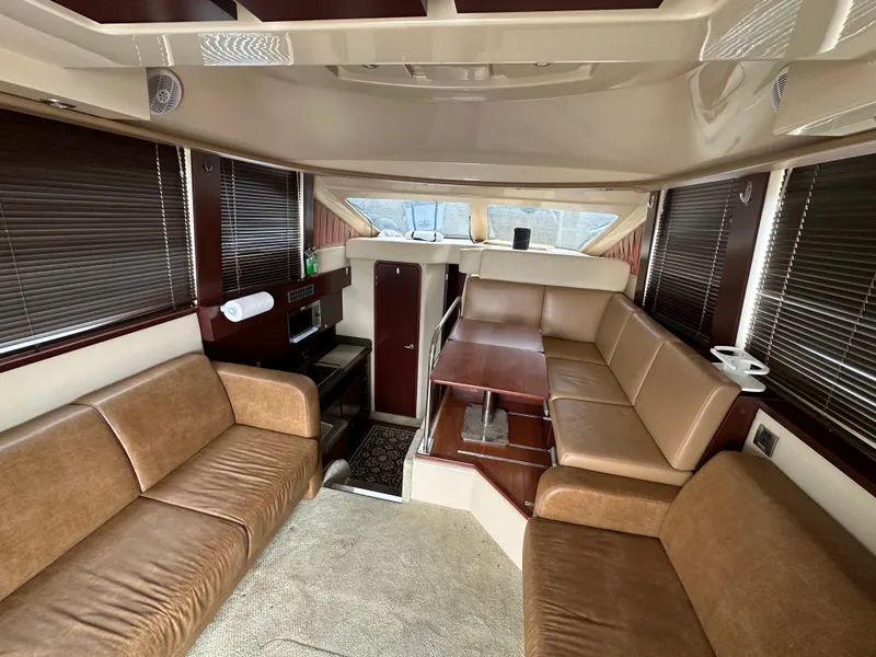 Slide: The Image of Luxurious interior of 2007 Sea Ray 36 Sedan Bridge with plush seating and elegant design. - 24