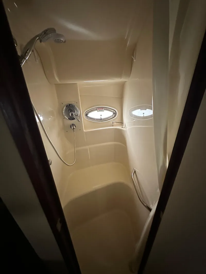 Slide: The Image of Shower area in 2007 Sea Ray 36 Sedan Bridge yacht with oval windows. - 26