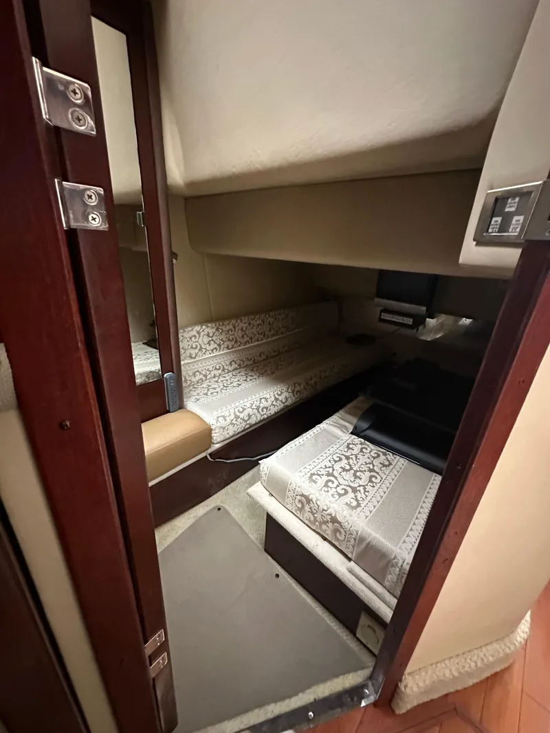 Slide: The Image of Interior cabin of 2007 Sea Ray 36 Sedan Bridge with twin beds. - 27