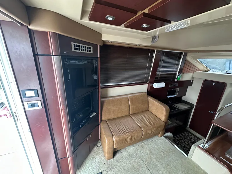 Slide: The Image of Interior of 2007 Sea Ray 36 Sedan Bridge with brown leather sofa and modern design. - 30