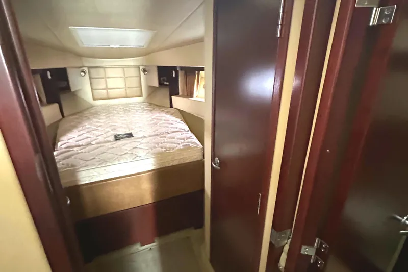 Slide: The Image of Interior cabin of 2007 Sea Ray 36 Sedan Bridge with cozy bed and wood finish. - 35