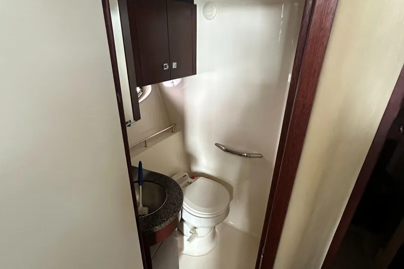 Slide: The Image of 2007 Sea Ray 36 Sedan Bridge bathroom interior with toilet and sink. - 36