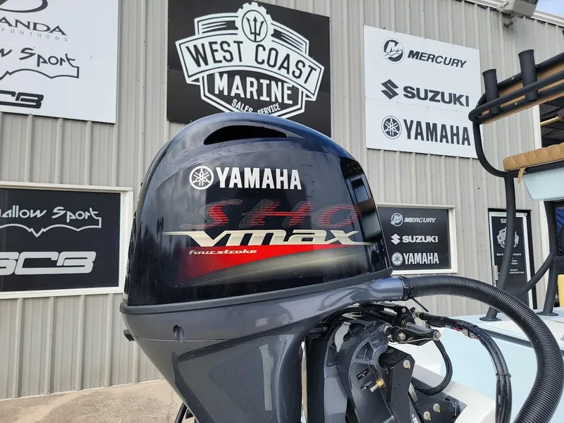 Slide: The Image of Yamaha VMAX outboard motor on 2025 Shallow Sport 18 Sport at West Coast Marine. - 11