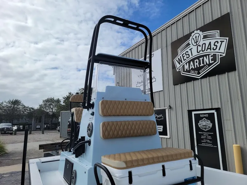 Slide: The Image of 2025 Shallow Sport 18 Sport boat at West Coast Marine dealership. - 4