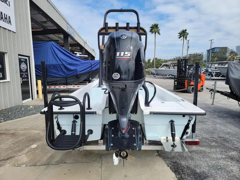 Slide: The Image of 2025 Shallow Sport 18 Sport boat with Yamaha 115 outboard motor, rear view. - 8