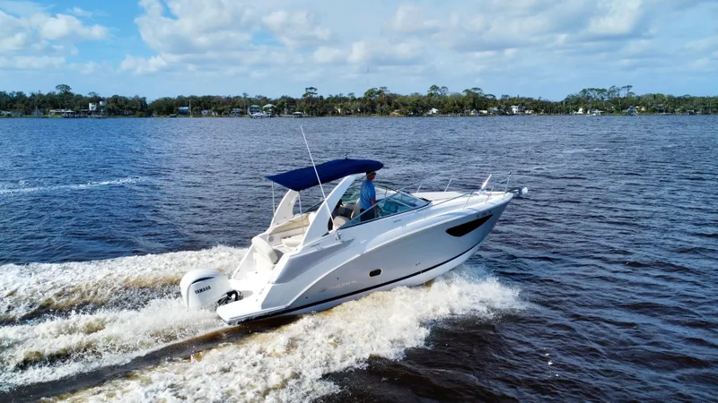 Slide: The Image of 2023 Regal 26 XO boat cruising on a sunny day. - 3