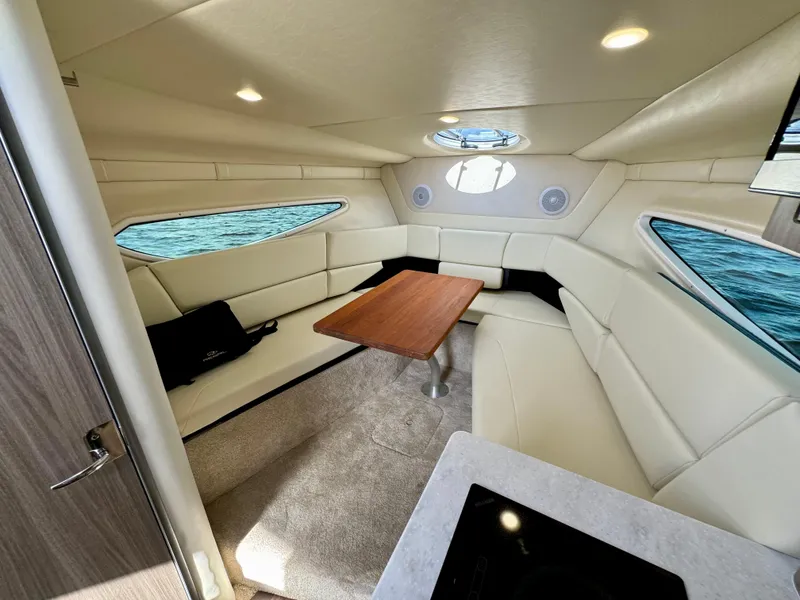 Slide: The Image of Luxurious interior of 2023 Regal 26 XO boat with elegant seating and wooden table. - 31