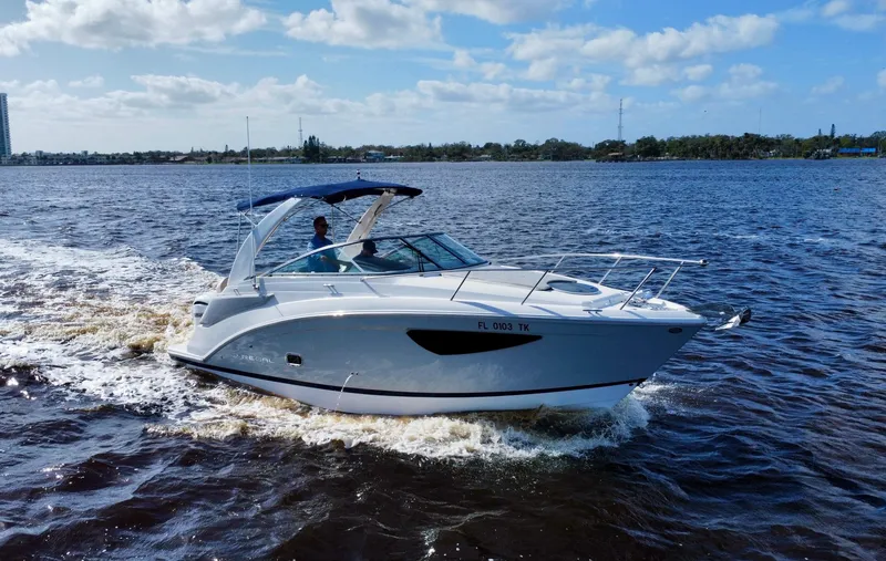 Slide: The Image of 2023 Regal 26 XO boat cruising on a sunny day. - 4