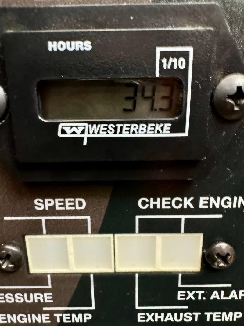 Slide: The Image of Westerbeke engine hour meter showing 34.3 hours on a 2023 Regal 26 XO. - 43