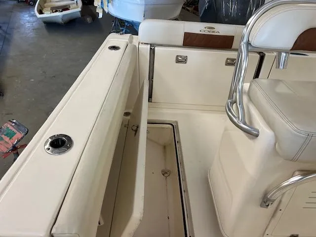 Slide: The Image of 2020 Cobia 237 Center Console boat interior with seating and storage compartments. - 9