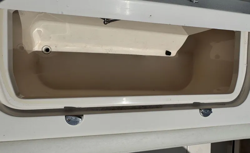 Slide: The Image of Open storage compartment on a 2016 Grady-White Freedom 285 boat. - 10