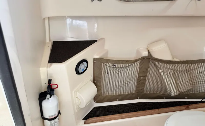 Slide: The Image of Interior of 2016 Grady-White Freedom 285 boat with storage net and fire extinguisher. - 21