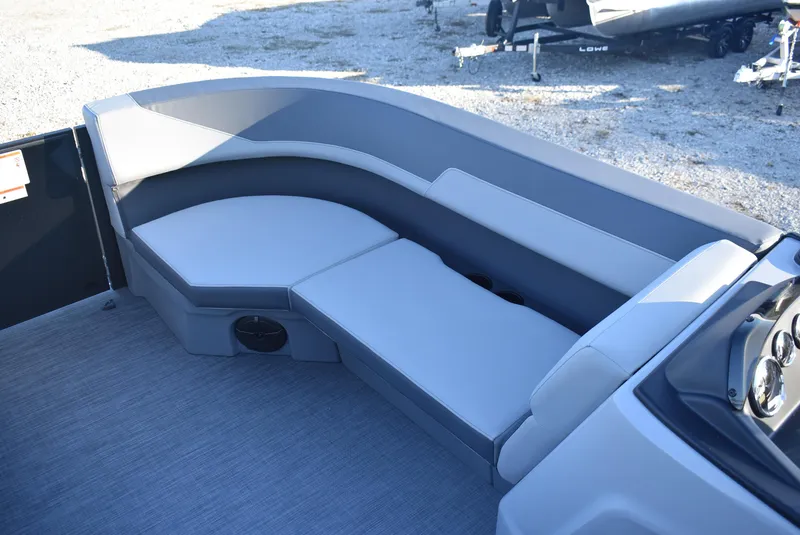 Slide: The Image of 2025 Lowe LS 190 boat interior with gray seating and modern design. - 12