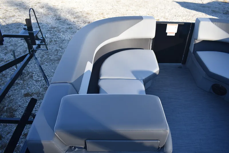 Slide: The Image of 2025 Lowe LS 190 boat interior with gray seating and carpeted floor. - 13