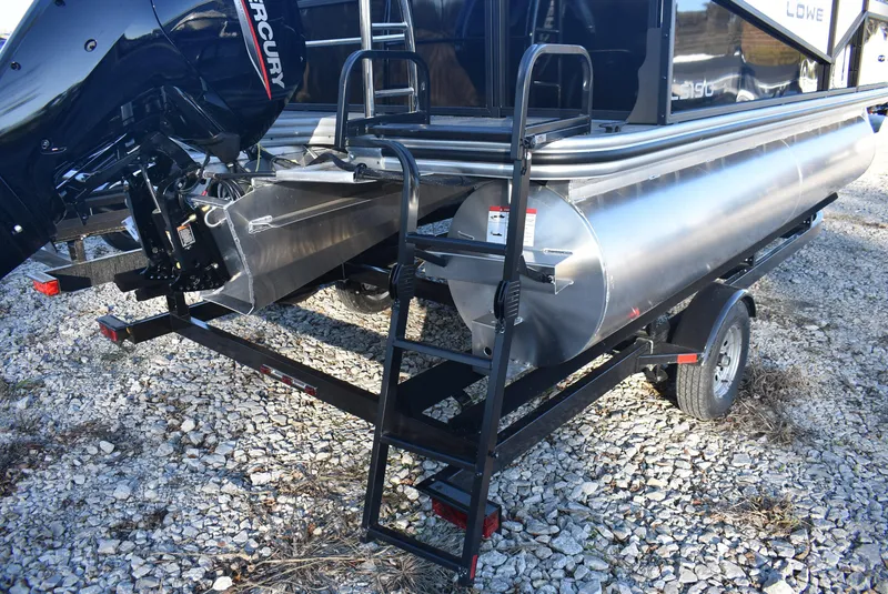 Slide: The Image of 2025 Lowe LS 190 pontoon boat on trailer, featuring Mercury outboard motor. - 6