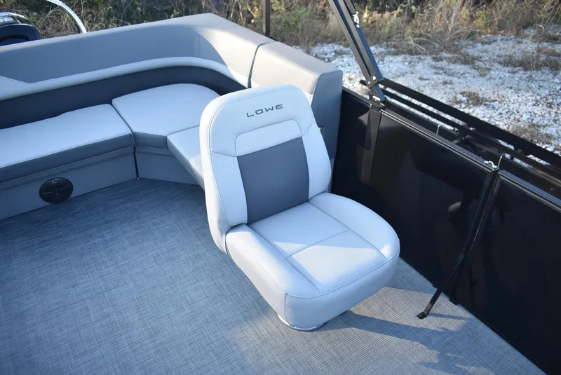Slide: The Image of Lowe LS 190 boat interior, 2025 model, featuring gray seating and carpeted flooring. - 8