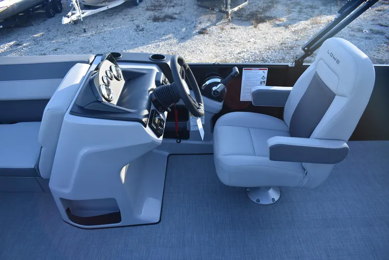 Slide: The Image of 2025 Lowe LS 190 boat interior with steering console and captain's chair. - 9