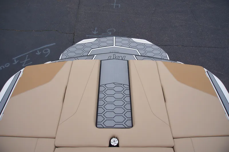Slide: The Image of 2025 MasterCraft NXT23 boat deck with tan and gray hexagonal pattern. - 7