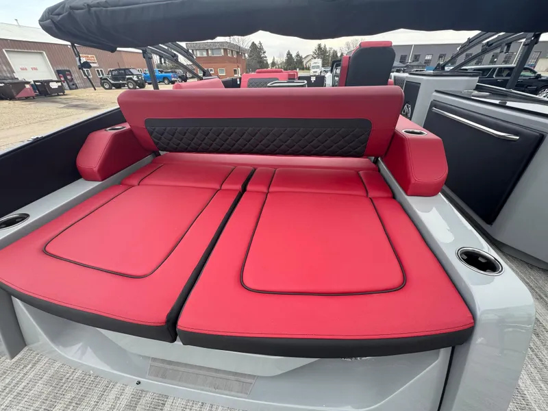 Slide: The Image of 2025 Godfrey AQUAPATIO 255SFL boat with luxurious red seating and modern design. - 10