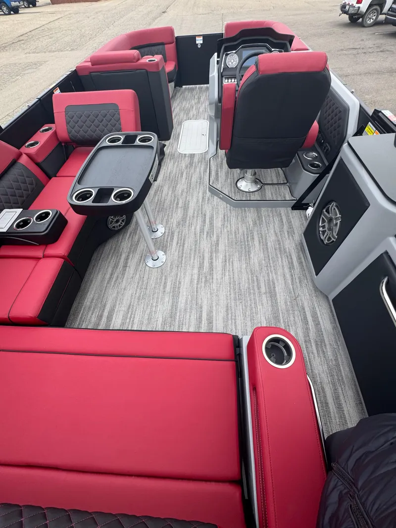 Slide: The Image of Luxurious interior of 2025 Godfrey AQUAPATIO 255SFL pontoon boat with red and black seating. - 11