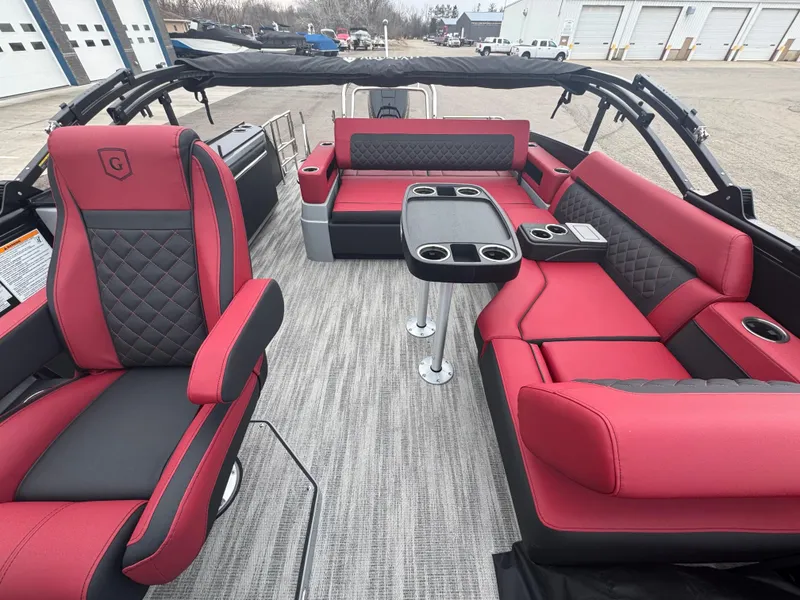 Slide: The Image of Luxurious interior of 2025 Godfrey AQUAPATIO 255SFL pontoon boat with red and black seating. - 18