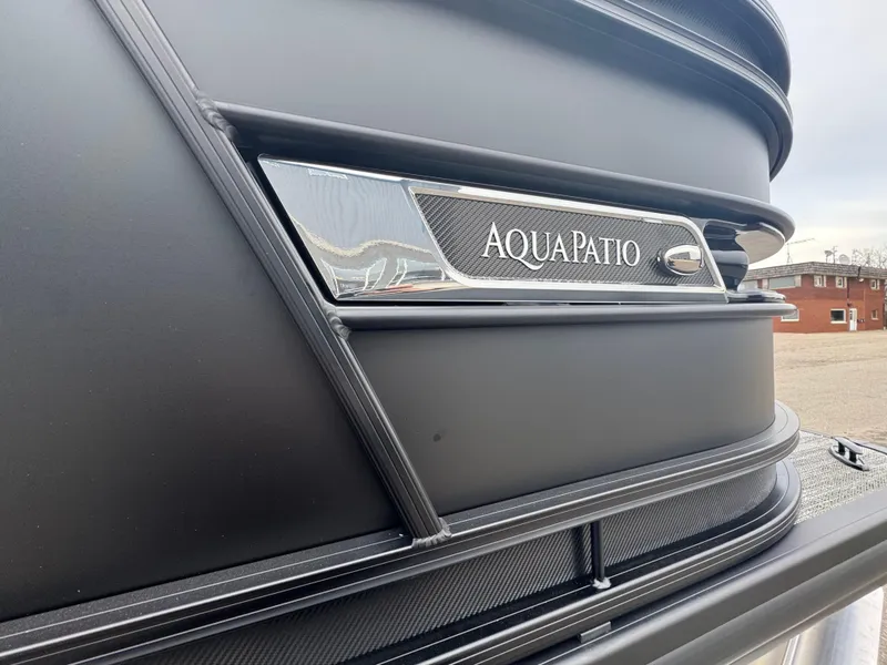 Slide: The Image of 2025 Godfrey AQUAPATIO 255SFL boat detail with sleek design and branding. - 7