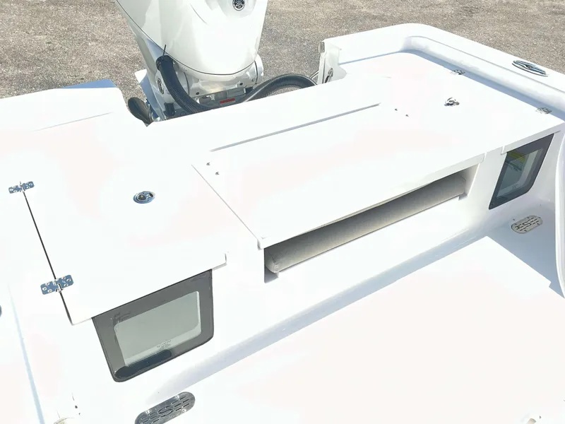 Slide: The Image of 2025 Sportsman 247 MASTERS boat deck with storage compartments and motor. - 13