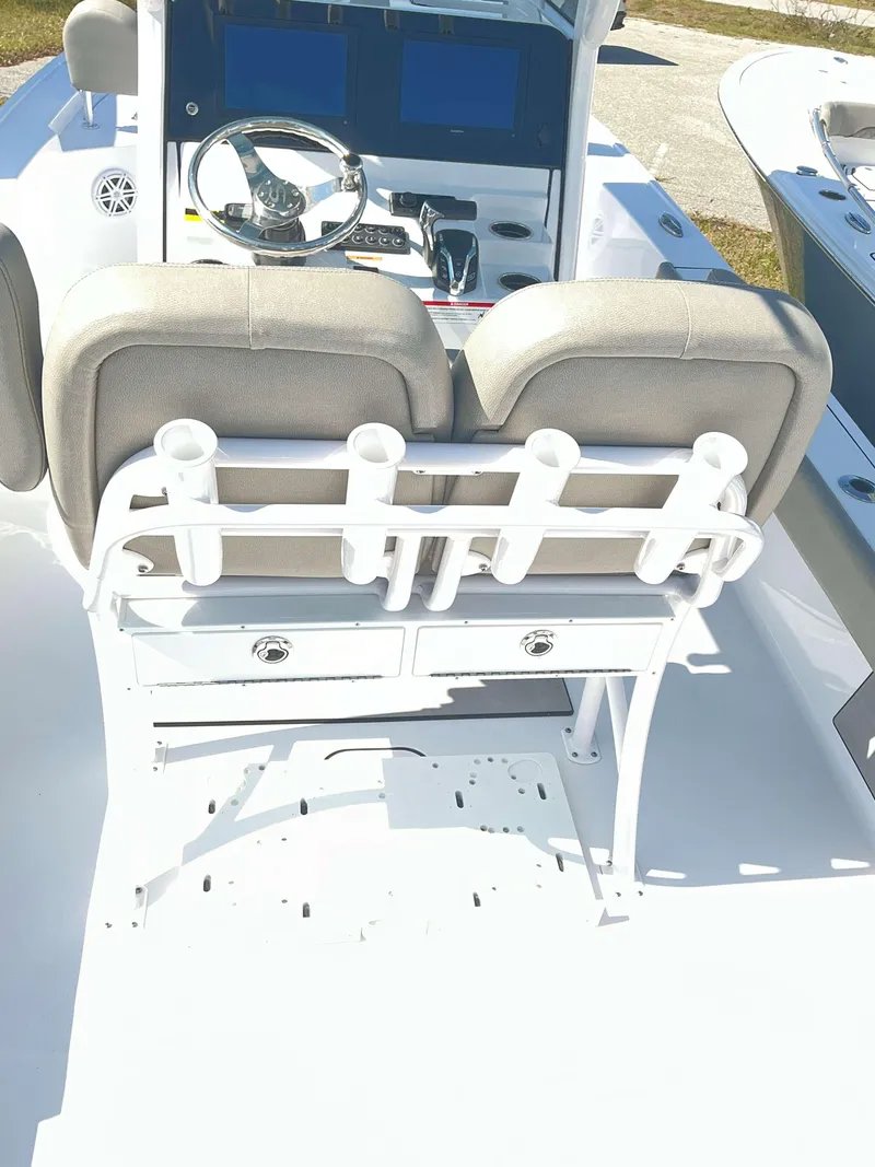 Slide: The Image of 2025 Sportsman 247 MASTERS boat interior with dual seats and rod holders. - 14