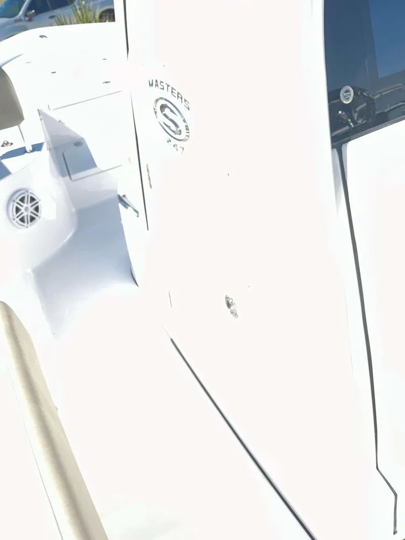 Slide: The Image of 2025 Sportsman 247 MASTERS boat interior, featuring sleek white design and modern details. - 15